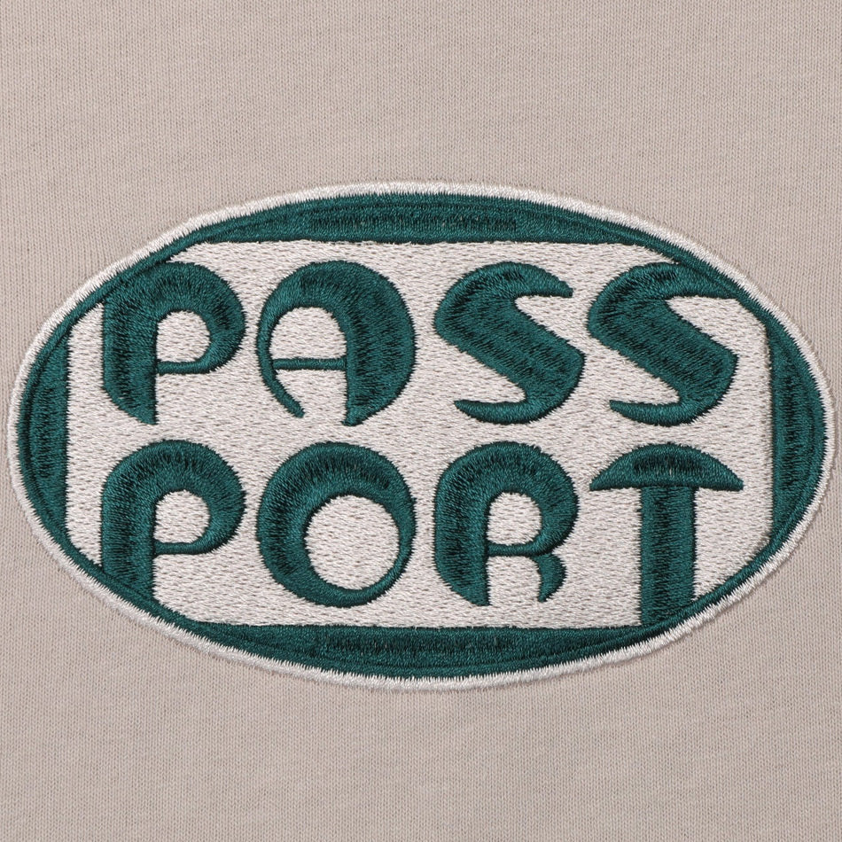 Pass~Port - Rounded Tee - Stone